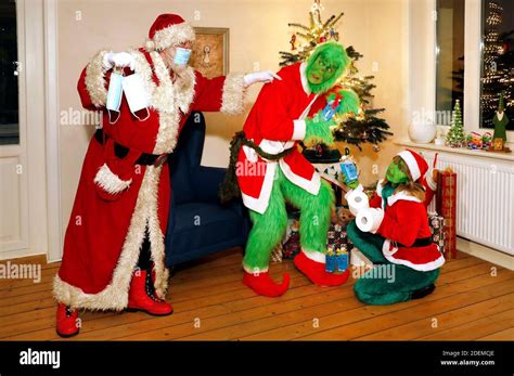 Santa Claus Catches The Grinch And Mrs Grinch Stealing Presents And Tells Them To Wear A