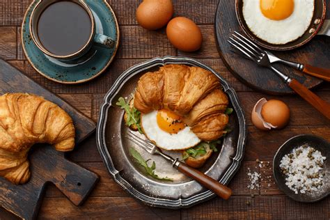 perfectly baked breakfast croissant ham cheese and eggs rakija grill