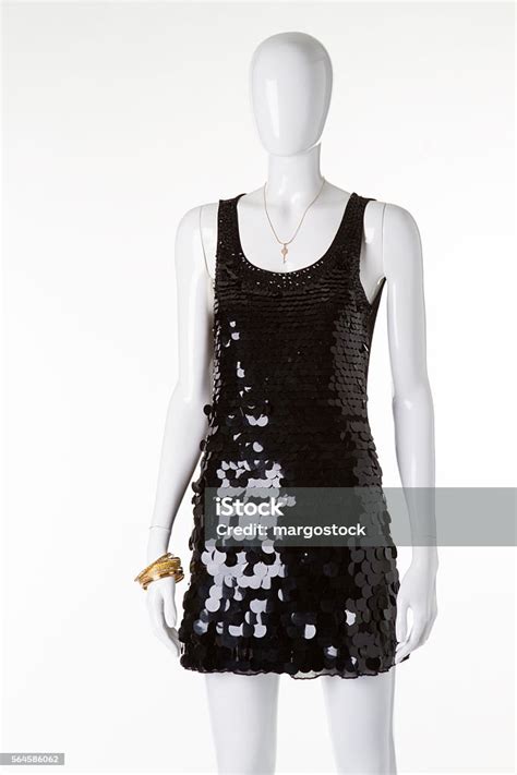 Shiny Black Dress With Sequins On A White Mannequin Stock Photo