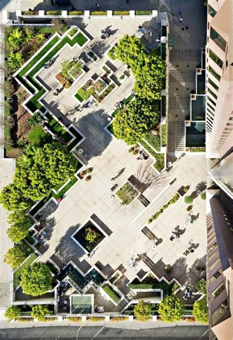 An Aerial View Of A City With Trees And Buildings