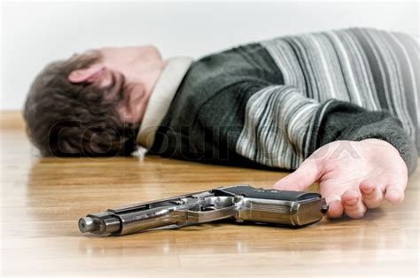 Man With Gun Laying On The Floor Stock Image Colourbox