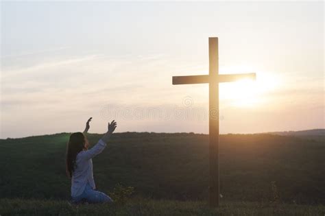 Woman Kneeling At The Cross