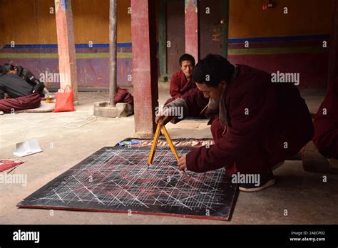 Buddhist Monk Practicing Drawing A Mandala Inside Sakya Monastery