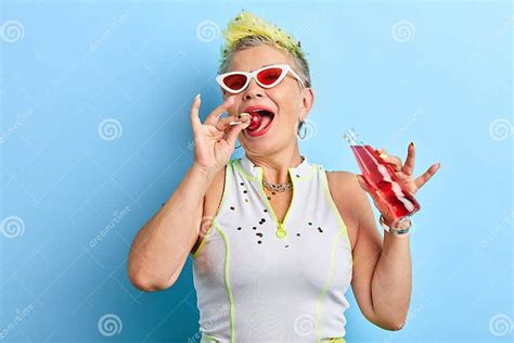 Glamour Charming Mature Woman Sucking Licking Lollipop Stock Image