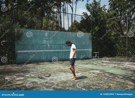 Man Standing In A Tennis Court Stock Photo Image Of Chic Tennis
