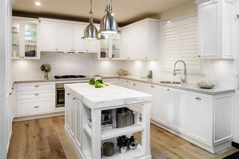 Crisp, clean white kitchens with gleaming marble counters and backsplashes are everywhere you look these days. Hamptons Kitchen | Casual Elegance | Farmers Doors