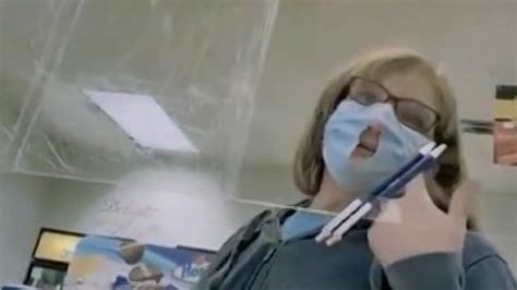 Watch American Woman Cuts Hole In Her Face Mask To Make It Easier To