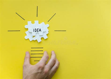 Light Bulb Over Yellow Background In Vision And Idea Conceptual Image
