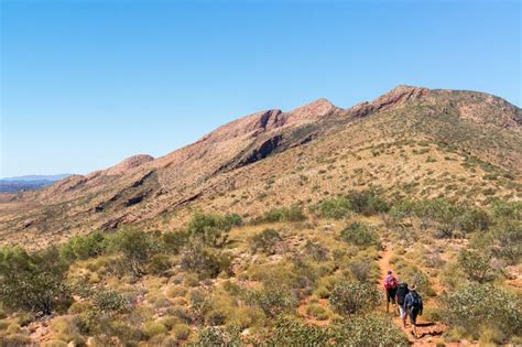 Hikers On The Way To The Top Of Mount Sonder Just Outside Alice Springs