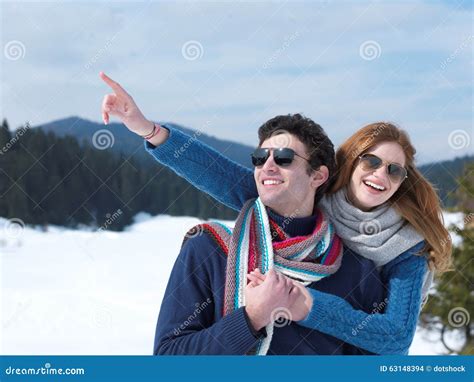 Happy Young Couple Having Fun On Fresh Show On Winter Vacation Stock