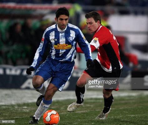 Vahid Hashemian Of Bochum And Hanno Balitsch Of Hannover Battle For