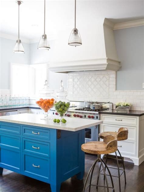 A Bright Blue Kitchen Island Creates A Cheerful Feeling In This White