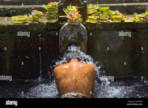 Indonesia Bali Balinese Man Bathing With Holy Spring Water Stock Photo