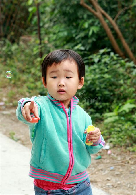 Chinese children playing. stock image. Image of clothes - 7113265