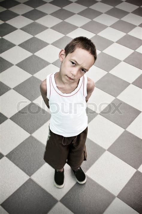 Sad Boy Standing Alone Over Black And White Background Stock Photo