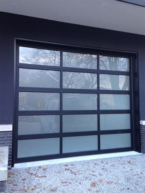 Oversized Aluminum Frosted Glass Garage Door In Custom Home In Oakville