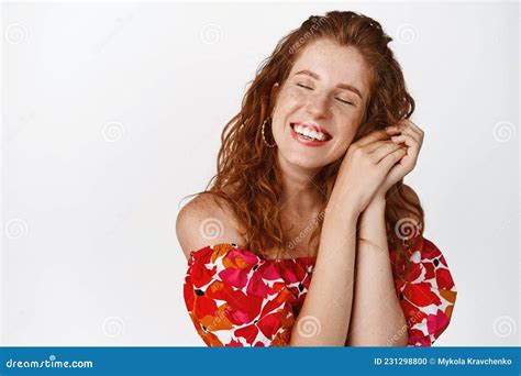 beauty and women concept dreamy smiling woman with red curly hairstyle close eyes and grinning