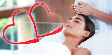 composite image of woman on her massage session with love hearts stock illustration