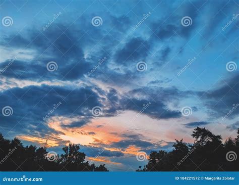 Sunset Cloudy Sky With Picturesque Clouds Lit By Warm Sunset Sunlight