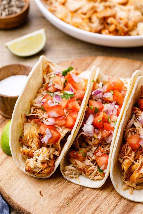 Add 2 1/2 pounds boneless, skinless chicken breasts, turn to coat in the salsa, then arrange in an even layer. 7-Ingredient Instant Pot Shredded Chicken Tacos - Miss Wish
