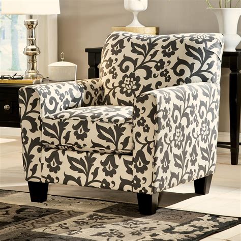 The luxurious sofa and loveseat are upholstered in a beautiful bone pu with button tufted backs,the. Ashley Signature Design Levon - Charcoal 7340321 Accent ...