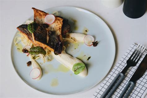 Recipe Pan Fried Sea Bass With Cauliflower Purée And Fennel Salad Time Out Dubai