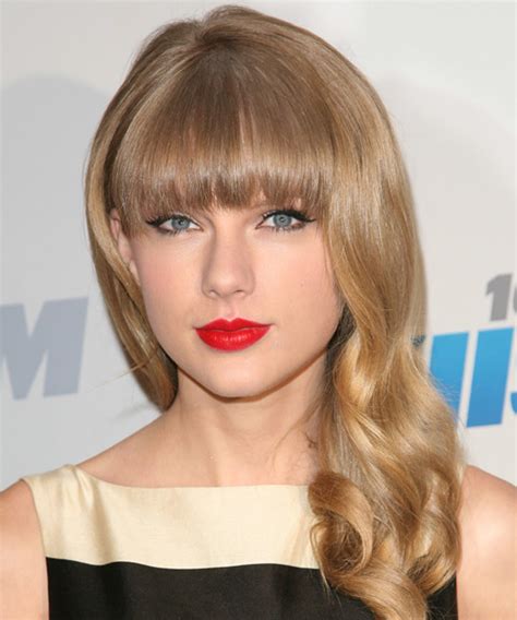 Taylor Swift Long Wavy Honey Blonde Hairstyle With Blunt Cut Bangs