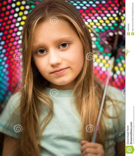Young Girl With Long Hair Holding An Umbrella Stock Image