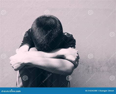 Young Boy Sitting Alone And Sad At The School Stock Photo Image Of