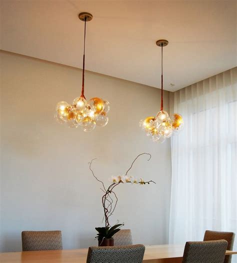 15 mid-century modern brass chandeliers for a contract ...