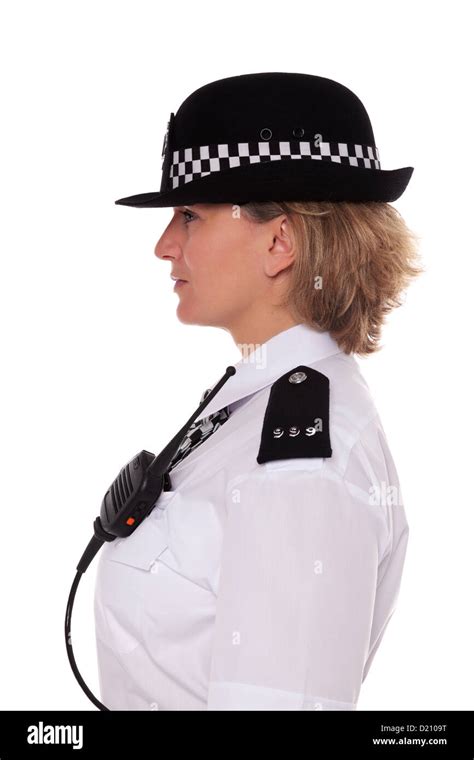 Studio Shot Of A Female British Police Officer In Uniform Side Profile