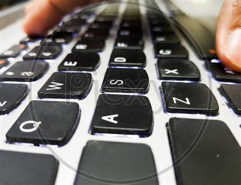 Image Of Fingers Pressing Keys On Laptop Isolated Keyboard A Close Up