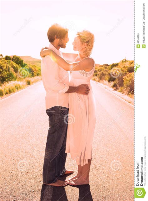 Attractive Couple Embracing Barefoot On The Road Stock Illustration