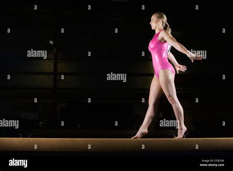Female Gymnast Performing Routine On Balance Beam Stock Photo Alamy