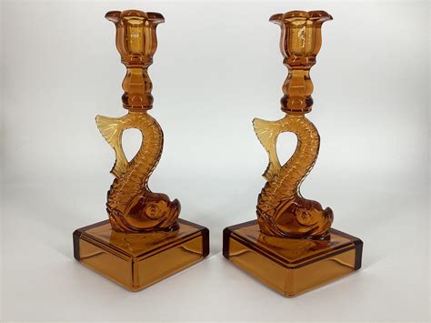 Lot Pair Heisey Amber Dolphin Candlesticks