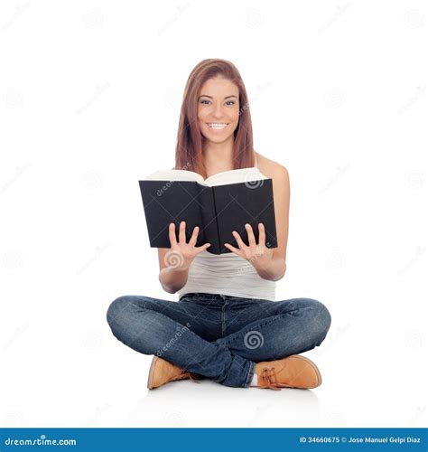 Casual Young Woman Sitting On The Floor Reading A Book Royalty Free