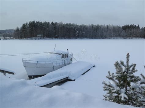 Frozen Lake And Boat Covered In Snow In Finland Stock Image Image Of