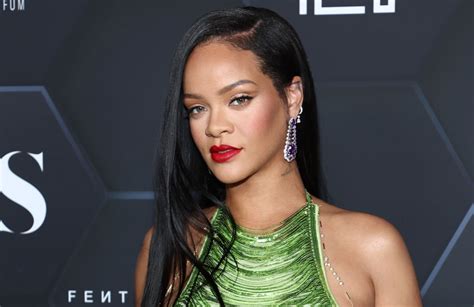 rihanna exposes part of her rear by modeling a daring set of lingerie imageantra