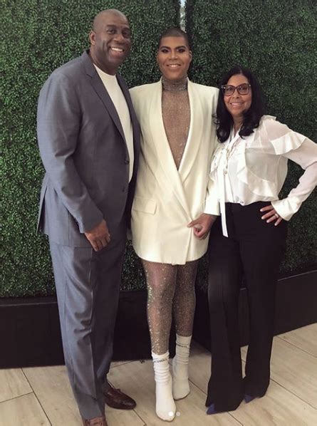 Former nba player earvin 'magic' johnson, his wife cookie and their son andre johnson attend the usa today hollywood hero | photo: EJ Johnson On Coming Out To His Father Magic Johnson: I ...