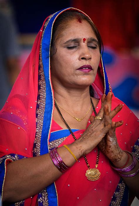 A Hindu Woman Prays Photograph By Lee Craker
