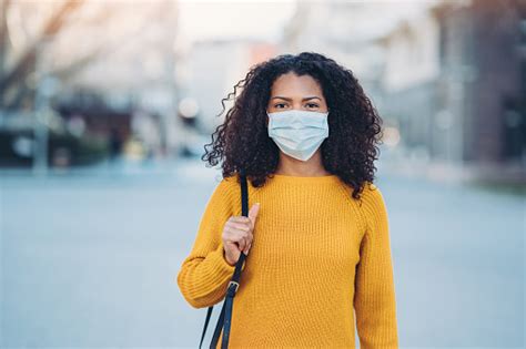 Young Woman With A Mask During Pandemic Stock Photo Download Image