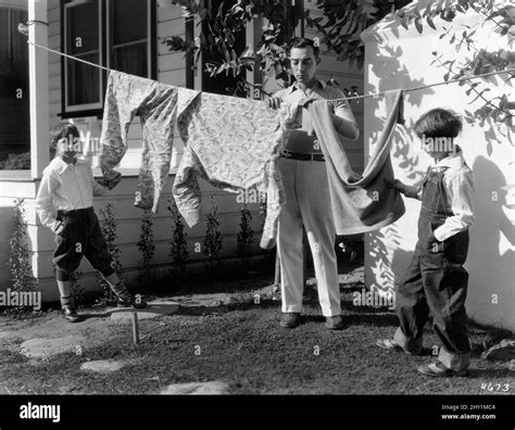 Buster Keaton With His Two Sons Joseph And Robert Hanging Laundry