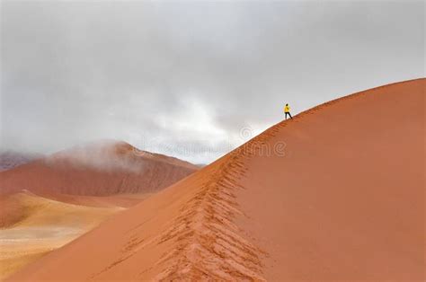 Woman Tourist Walking On Red Sand Dunes Sossusvlei Namib Desert