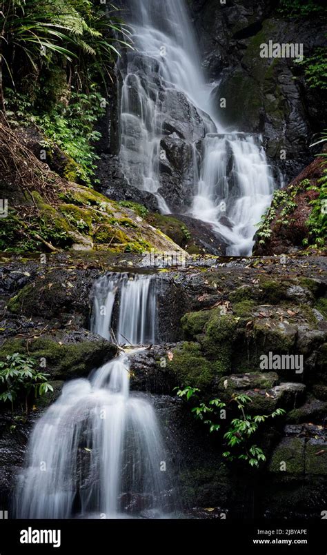 Waterfall Flowing Down Rocky Surface Stock Photo Alamy