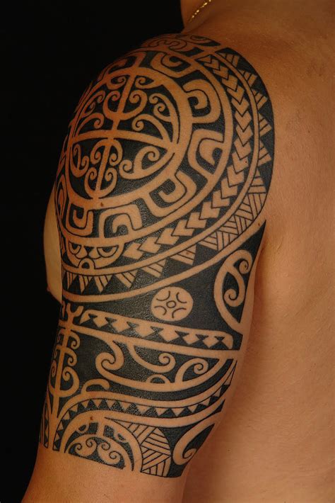 This black ink arm tattoo idea is for the true traveler. Maori Arm Celebrity Tattoo