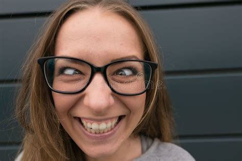 Large Portrait Of A Girl With Glasses On A Gray Background Stock Image