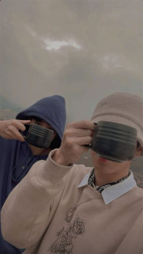 Two People Wearing Blindfolds Are Looking At Something In The Distance