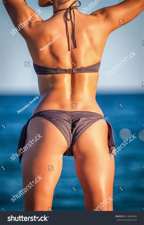 Sexy Back Of A Beautiful Woman In Bikini On Sea Background Stock Photo