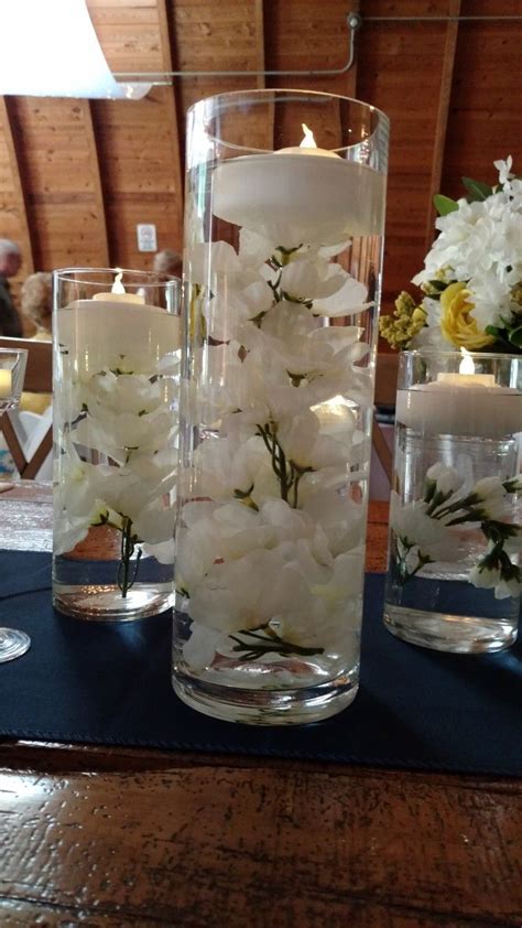 Glass Cylinder Centerpieces With Floating Candles Floating Candle Centerpieces Wedding Table