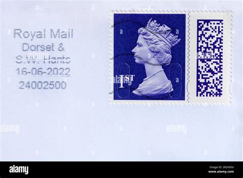Purple 1st Class Stamp With Queen Elizabeth Ii Head Stuck On Envelope